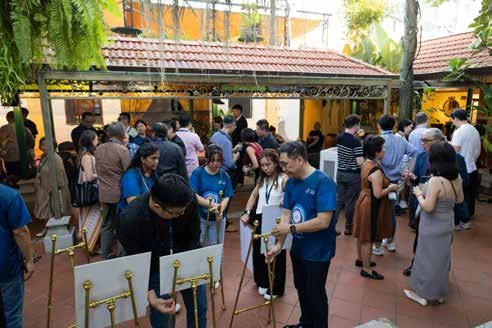 Guests gathering at an O-EARTH exhibition